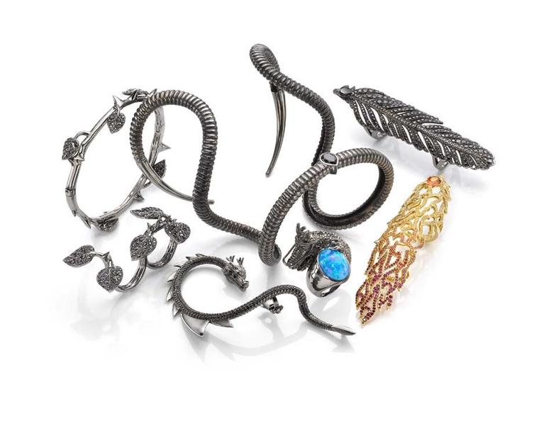 Daniel Belevitch, founder and creative director of Crow's Nest, used motifs such as thorns, horns, dragons, feathers and fire, for the seven-piece limited-edition collection of statement rings, bracelets and an ear cuff set in rhodium with black diamonds.